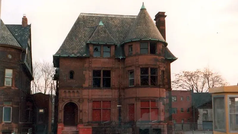 Brick Victorian house with steep roofs and a turret