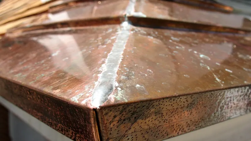 Close-up of a copper sheet-metal roof edge